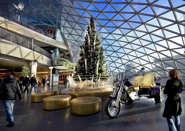 picture of the glass roof over an inside plaza with christmas decorations at zlote tarasy
