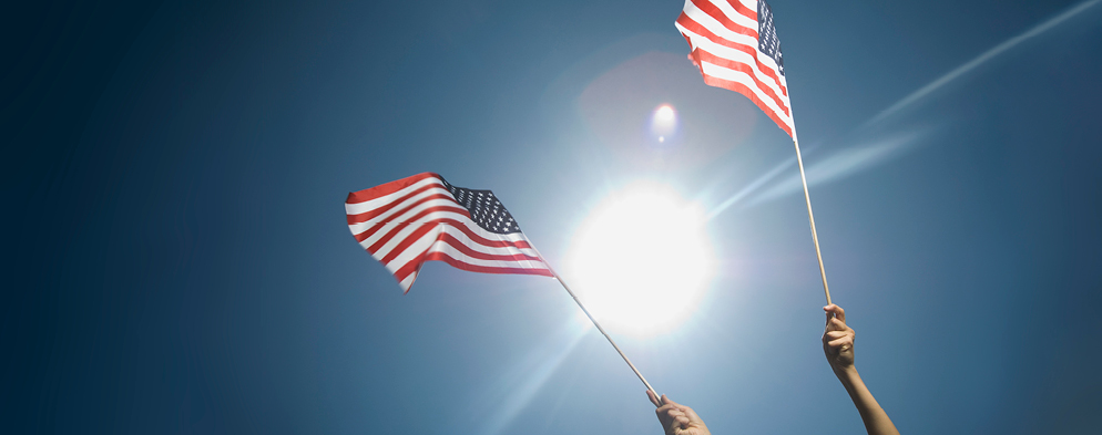 American flags with sunlight shining through